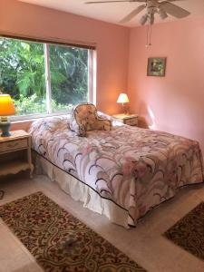 a bedroom with a bed in front of a window at Beautiful Quiet Studio!! in Sarasota