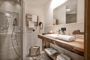 a bathroom with a sink and a shower at Herzwies in Bad Hofgastein