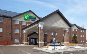 a hotel with a sign on the front of it at Holiday Inn Express Hotel & Suites St. Paul - Woodbury, an IHG Hotel in Woodbury