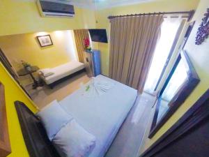 Postel nebo postele na pokoji v ubytování Hotel Melina