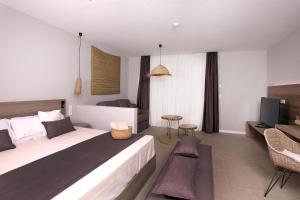 Posteľ alebo postele v izbe v ubytovaní Eques Petit Resort
