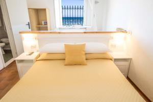 Postel nebo postele na pokoji v ubytování Hotel Villa Sole Resort