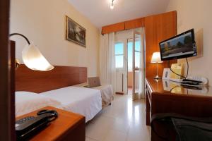 TV a/nebo společenská místnost v ubytování Hotel Michelangelo