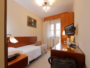 TV a/nebo společenská místnost v ubytování Hotel Michelangelo
