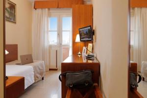 TV a/nebo společenská místnost v ubytování Hotel Michelangelo