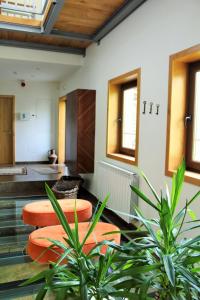 a lobby with benches and plants in a building at Moinho da Ponte Velha in Bragança