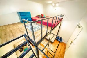 a room with a bunk bed and a staircase at Old Town Kanonia Hostel & Apartments in Warsaw