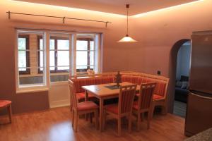 a dining room with a table and chairs at Apartments Gamsfeld in Russbach am Pass Gschütt