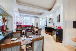 a dining room with a table and chairs at Admiral Hotel at Park Avenue in London