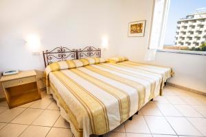Postel nebo postele na pokoji v ubytování Hotel Villa Sole Resort