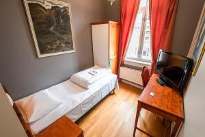 Una cama o camas en una habitación de Grand Hotel Hønefoss