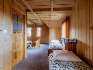 Un pat sau paturi într-o cameră la Dom Wypoczynkowy u Gałów