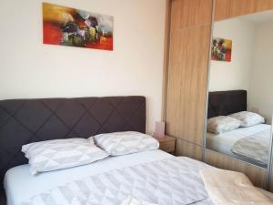 Ένα ή περισσότερα κρεβάτια σε δωμάτιο στο Apartman Kala