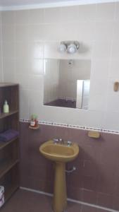 a bathroom with a sink and a mirror at Buen Descanso in Salta +36 photos