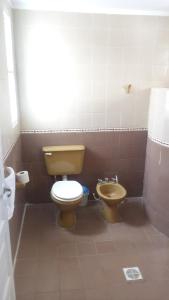 a bathroom with a toilet and a bidet at Buen Descanso in Salta