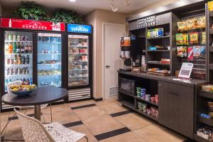 a grocery store with a table and a refrigerator at Candlewood Suites Sierra Vista by IHG in Sierra Vista