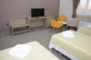 Postel nebo postele na pokoji v ubytování Hotel Intergaj Bijeljina