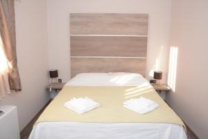 Postel nebo postele na pokoji v ubytování Hotel Intergaj Bijeljina