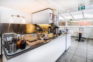 a kitchen with a counter with food on it at Guesthouse Andrea in Reykjavík