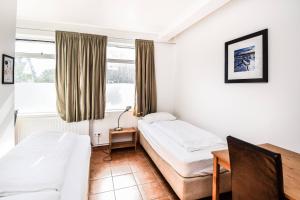Letto o letti in una camera di Guesthouse Aurora