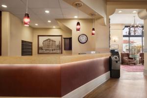 a waiting room at a hospital with a clock on the wall at The Plaza Hotel a Trademark Collection by Wyndham in Kamloops