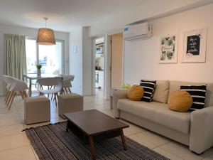 a living room with a couch and a table at Rent a Flat in Cordoba