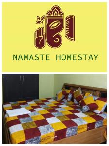 a bedroom with a bed with a sign that readsannisannis homesay at Namaste Homestay in Khajurāho