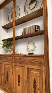a wooden hutch with two plates on top of it at Soho Boutique Sevilla in Seville