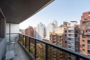 a balcony with a view of the city at AT Suites in Córdoba