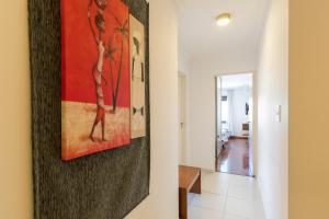 a hallway with a painting on the wall at AT Suites in Córdoba