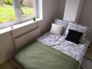 Postel nebo postele na pokoji v ubytování Apartamenty Parkowa