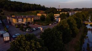 an aerial view of a town with a parking lot at Hotel Michelangelo in Terranuova Bracciolini