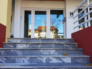 a set of stairs in front of a house at Hotel Nordeste Shalom in Bragança