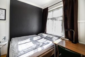 Uma cama ou camas num quarto em Guesthouse Andrea