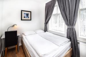 Uma cama ou camas num quarto em Guesthouse Andrea