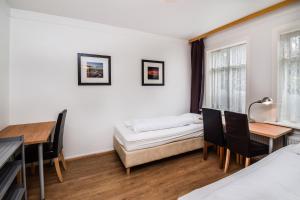Uma cama ou camas num quarto em Guesthouse Andrea