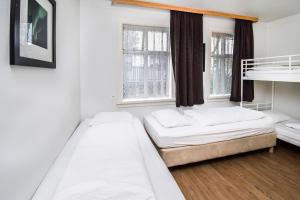 Uma cama ou camas num quarto em Guesthouse Andrea