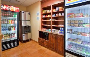 a store room with a refrigerator and food at Holiday Inn Express Las Cruces North, an IHG Hotel in Las Cruces