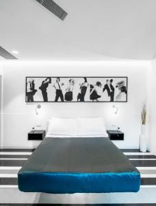 a bedroom with a bed with a black and white wall at V-Accommodation IV Fontane in Rome