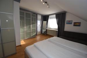 Postel nebo postele na pokoji v ubytování Haus Verdi