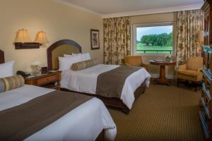 Una cama o camas en una habitación de Arnold Palmer's Bay Hill Club & Lodge
