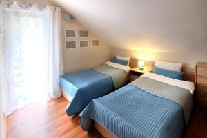 Letto o letti in una camera di Dom Kotik w Łukęcinie