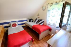 Letto o letti in una camera di Dom Kotik w Łukęcinie
