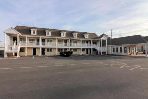 a large building with a parking lot in front of it at Anchorage Motel Inc. in Rehoboth Beach