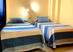 Posteľ alebo postele v izbe v ubytovaní Apartamentos La Puntilla Mogan