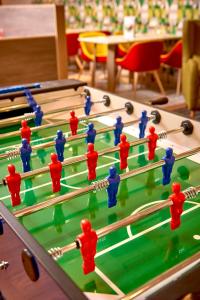 a group of people playing a game of billiards at Holiday Inn Northampton West M1 Junc 16, an IHG Hotel in Northampton