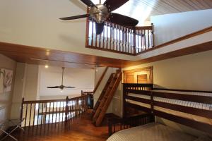 a room with a ceiling fan and a staircase at Kawartha Lakes, Fenelon Falls in Fenelon Falls