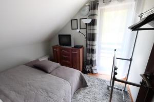 Letto o letti in una camera di Dom Kotik w Łukęcinie