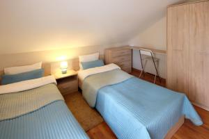 Letto o letti in una camera di Dom Kotik w Łukęcinie