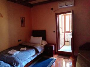 Postel nebo postele na pokoji v ubytování hotel arganier tafraoute